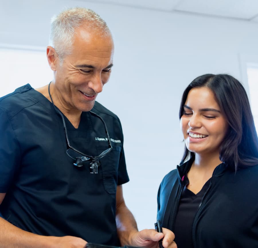 Dr. Jeffrey Epstein with a smiling patient.