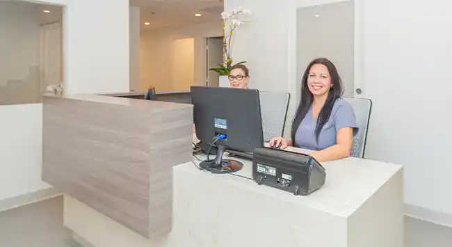 Reception staff at the front desk in Dr. Epstein's office.