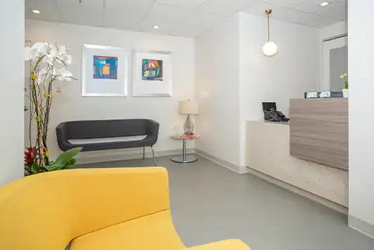 Waiting area at Dr. Epstein's office with seating and modern furnishings.