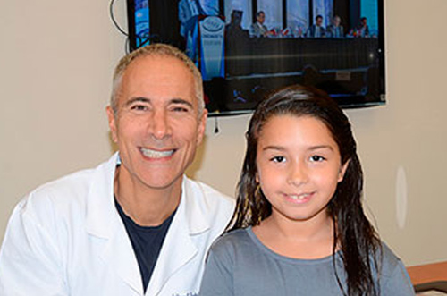 Dr. Jeffrey Epstein, Miami board-certified facial plastic surgeon, with a patient following treatment