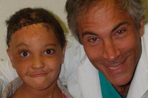 Dr. Jeffrey Epstein, Miami board-certified facial plastic surgeon, with a pediatric patient