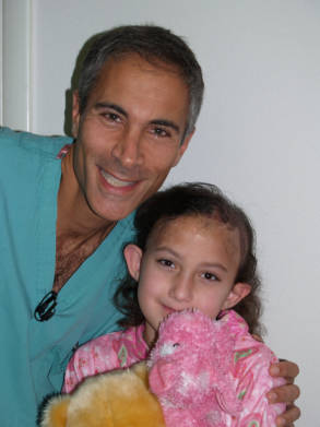 Dr. Jeffrey Epstein, Miami board-certified facial plastic surgeon, posing with a smiling young patient during a post-procedure follow-up visit.